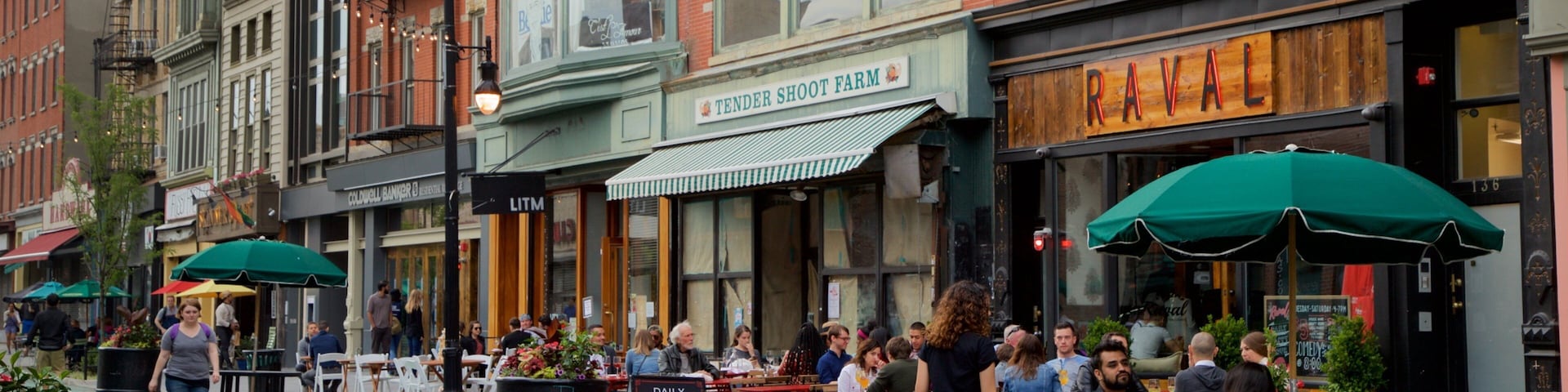 Downtown Jersey City showing outdoor eating as well as a small group of people