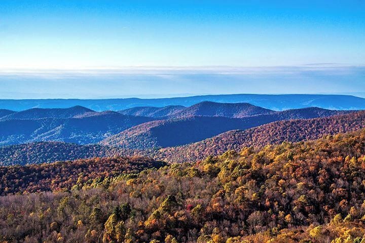 A mountainous landscape with autumn foliage.