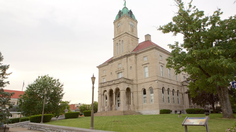 A historic building with a clock tower and a red roof.