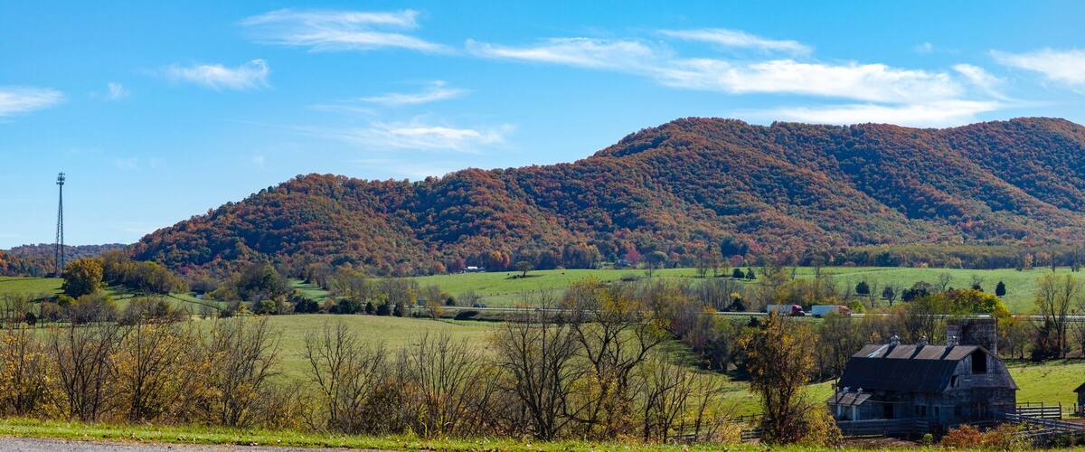 Panorama of mountains, valley and farmland with Interstate 77 in southwest Virginia.