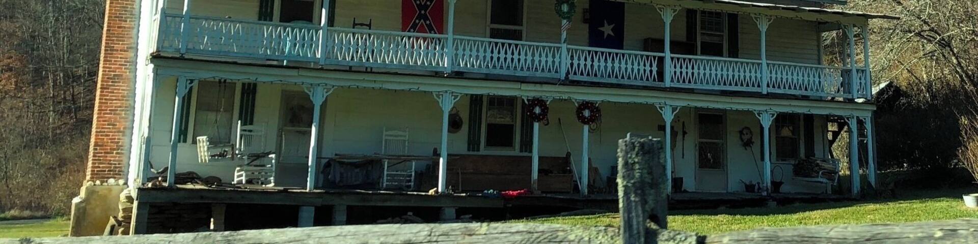 I took this picture in Carroll County, Va. I found this house by going down deep into the country roads. This picture represents what so many people think that mountain people live in. The house is ran down, it's surrounded by woods and there is a confederate flag displayed on the front of the house. When I saw this house, I instantly thought of a victorian style home in the 1950's and that whoever lived there most likely was considered wealthy. However, since the house is run down and has a confederate flag it may convey the idea that the people living in this house today are poor and a "redneck". I actually think that people who would rather live simple than extravagant live in this home. These people are probably your old time southerner. #appalchianechoes