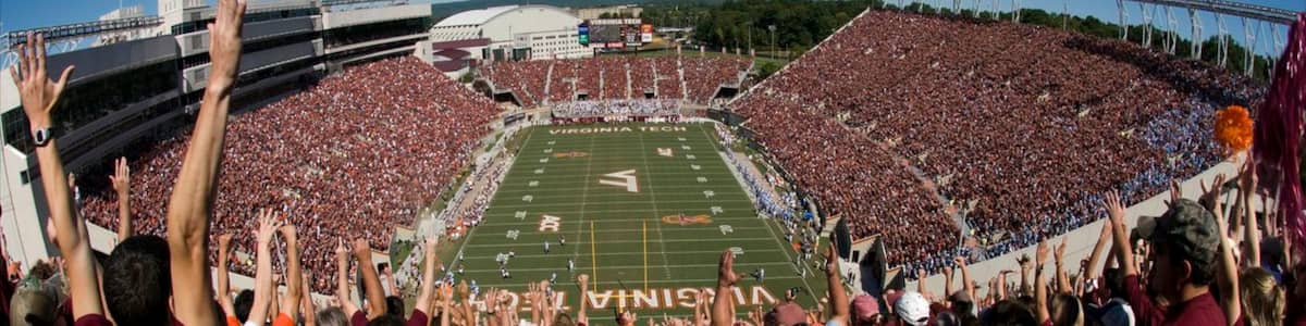 Blacksburg showing a sporting event as well as a large group of people