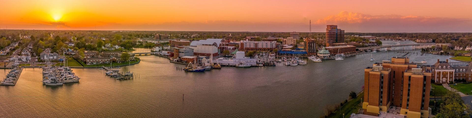 Stunning colorful sunset over Hampton Virginia with views of the harbor, air science center