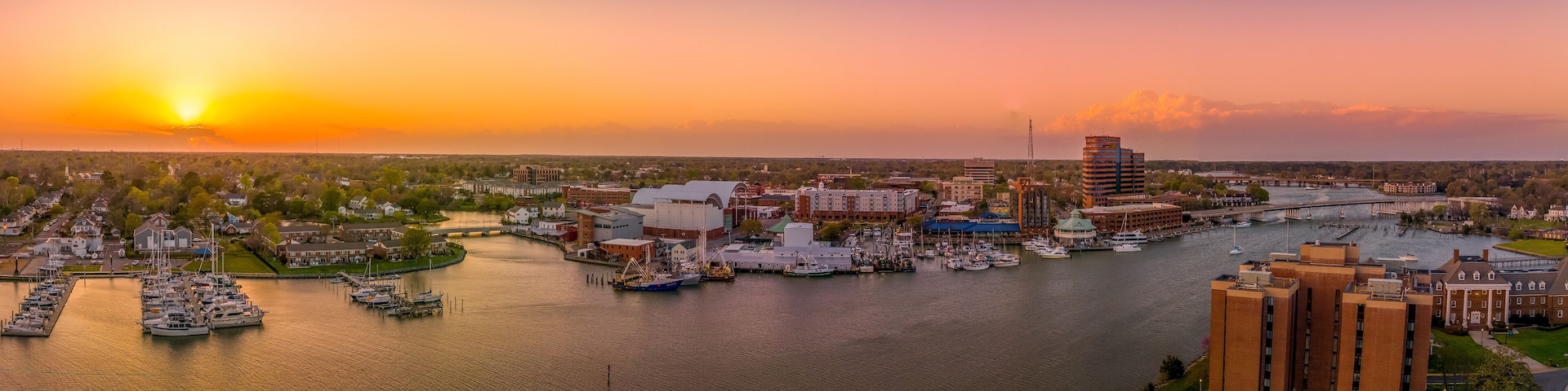 Stunning colorful sunset over Hampton Virginia with views of the harbor, air science center