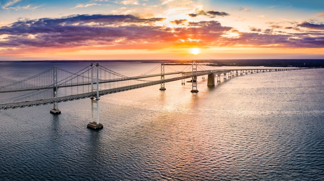 Aerial panorama of Chesapeake Bay Bridge at sunset. The Chesapeake Bay Bridge (known locally as the Bay Bridge) is a major dual-span bridge in the U.S. state of Maryland.