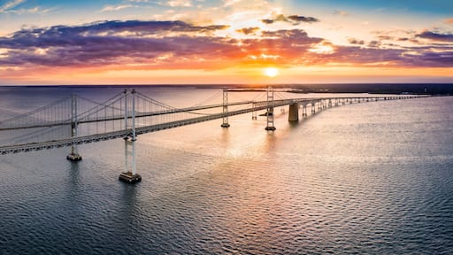 Aerial panorama of Chesapeake Bay Bridge at sunset. The Chesapeake Bay Bridge (known locally as the Bay Bridge) is a major dual-span bridge in the U.S. state of Maryland.