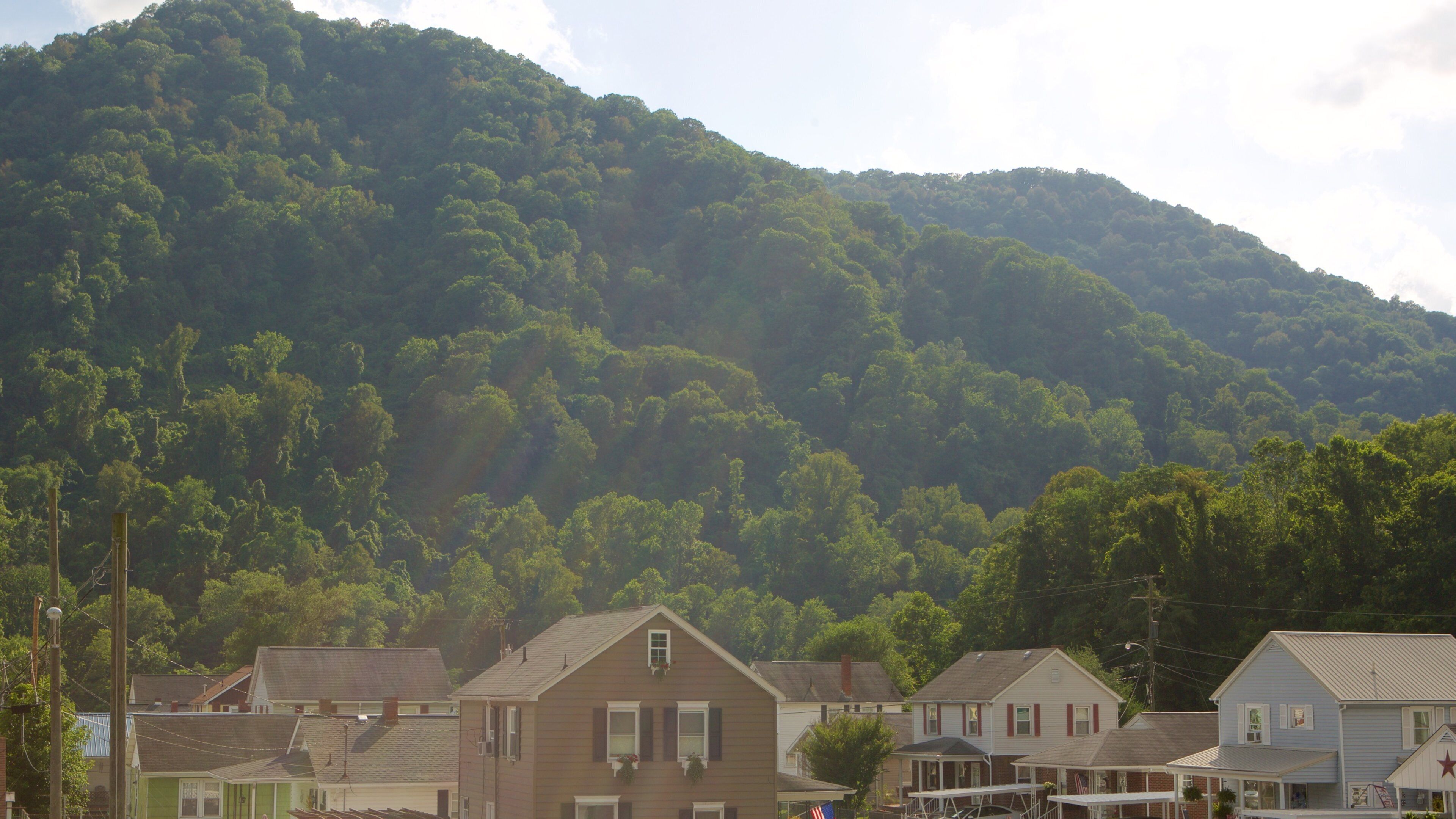 Central West Virginia which includes a small town or village, tranquil scenes and mountains