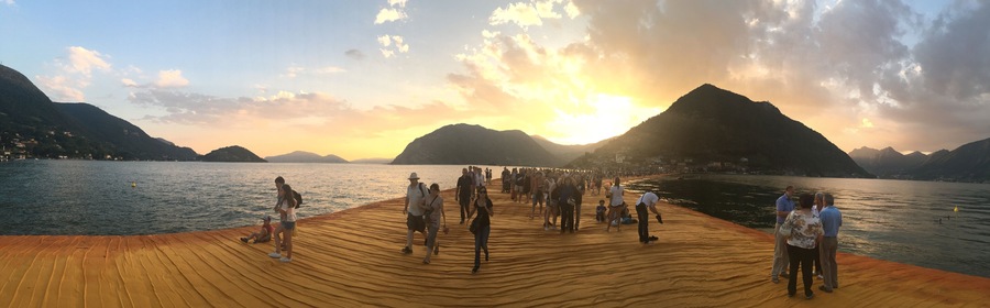 The Floating Piers on Lake Iseo near Sulzano, Italy at sunset.