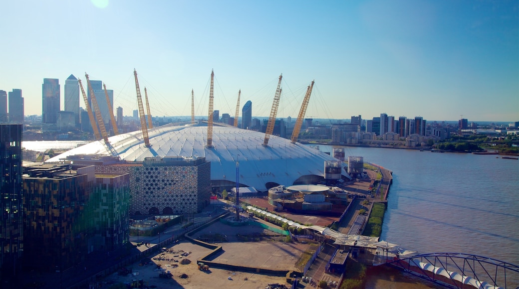 O2 Arena which includes modern architecture, a city and a river or creek