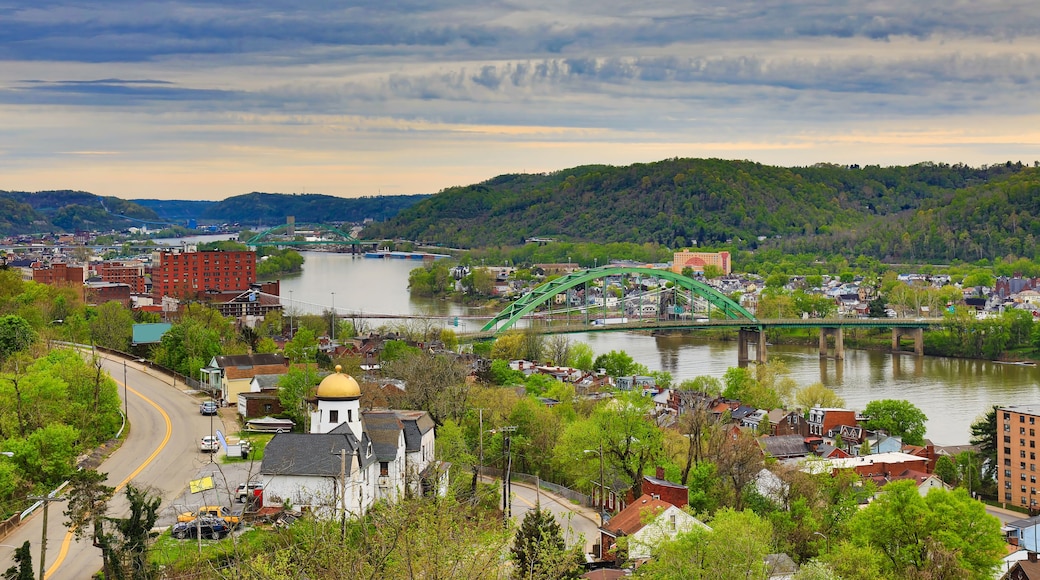 This is an aerial view of Wheeling, West Virginia along the Ohio River. This skyline cityscape shows Wheeling Island in the distance.