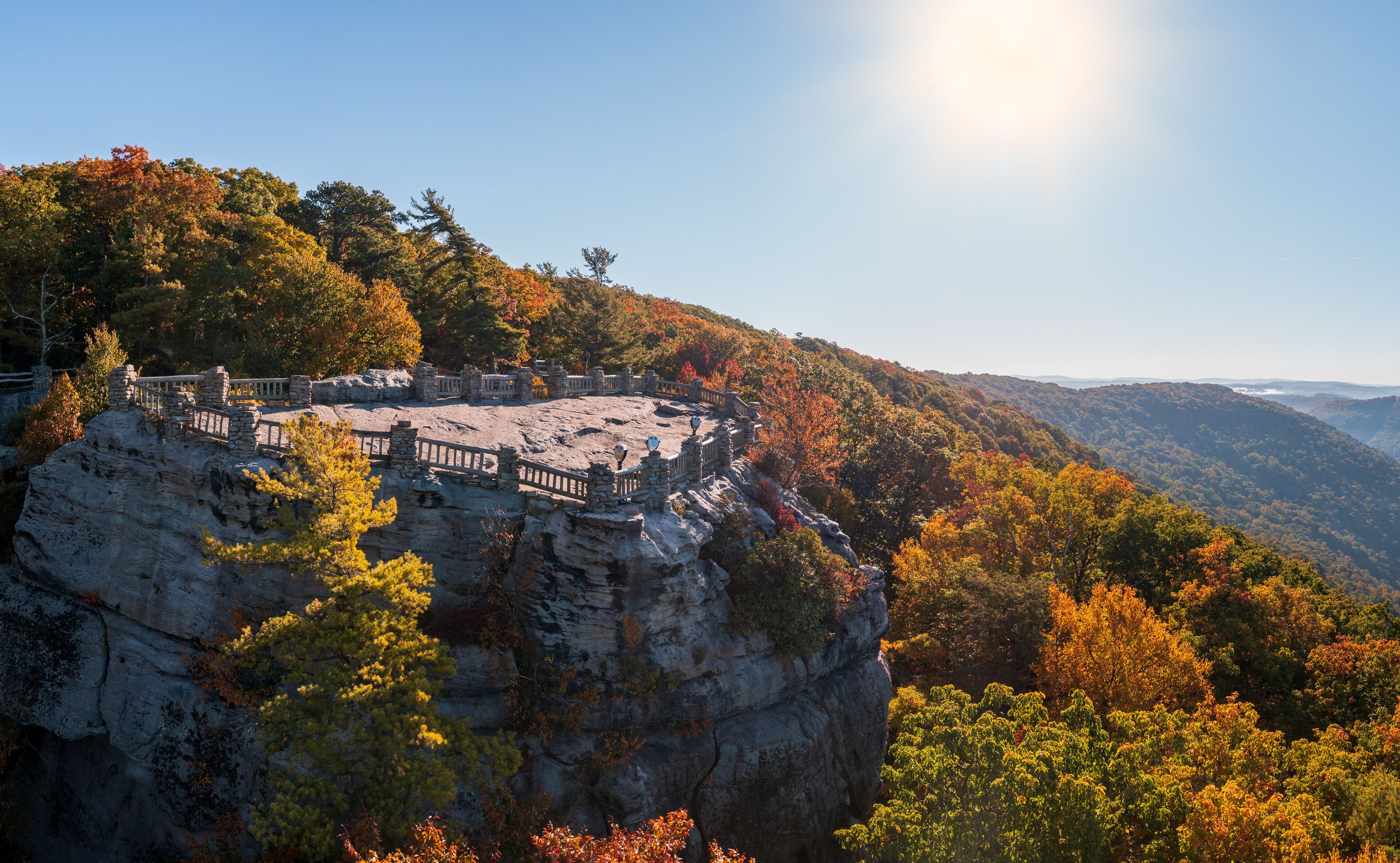 View up the Cheat River gorge in the autumn with Coopers Rock overlook in the colorful trees near Morgantown, West Virginia