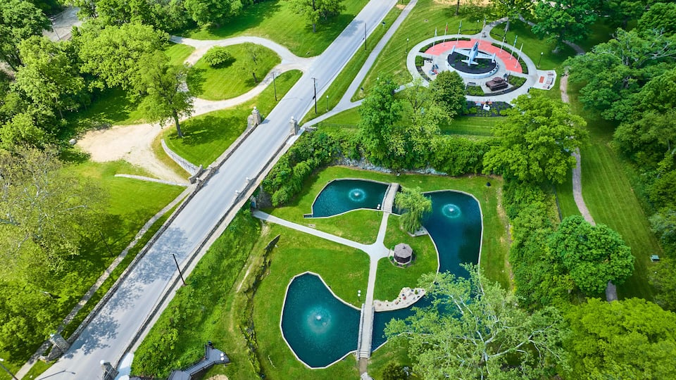 Aerial View of Huntington Memorial Park with Ponds and Monument