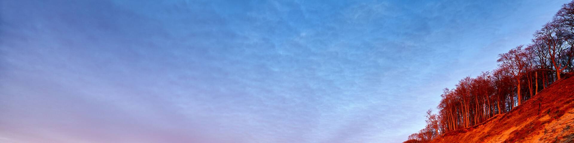 Cliff at a beach in Wolin National Park at sunset, Poland.