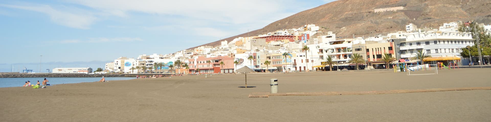 Views Of The Village From The Wonderful Black Sand Beach On A Sunny Day In The Great Tarajal. July 4, 2013. Gran Tarajal Tuineje Fuerteventura Canary Islands. Nature Vacation