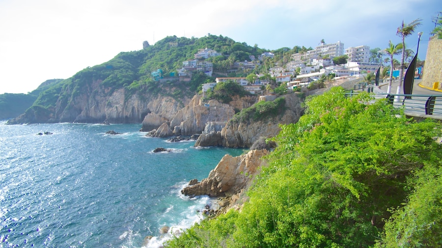 La Quebrada Cliffs featuring a gorge or canyon, rocky coastline and a coastal town