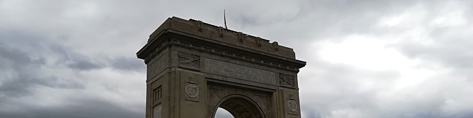 The first, wooden, triumphal arch was built hurriedly, after Romania gained its independence, so that the victourious troops could march under it.