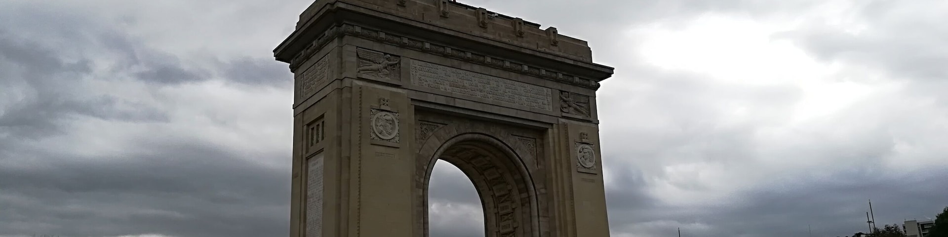 The first, wooden, triumphal arch was built hurriedly, after Romania gained its independence, so that the victourious troops could march under it.