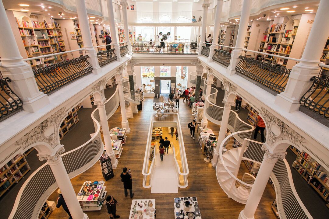 This is a relatively common photo from visitors to Bucharest these days, at least in some form or another. 

Carturesti Carusel is one of those bookstores that has an atmosphere that is difficult to describe. Daunt, in London, is another that comes to mind.

Although the selection might not differ from that of a typical chain store, there's something so fantastic and wonderful about a place like this.

#Europe #Romania #Bucharest #Building