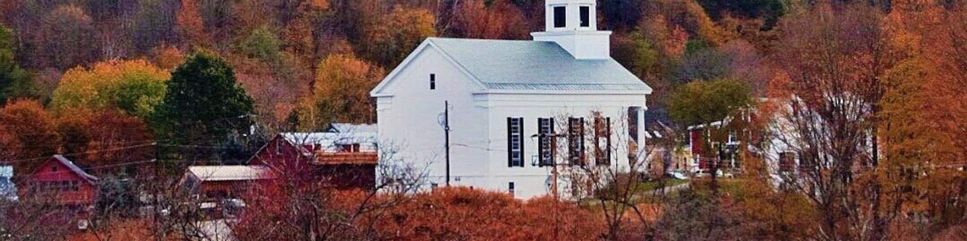 STOWE || To see Vermont and the surrounding countryside at its most spectacular, visit Stowe in Autumn. Frosty mornings give way to cool, crisp days - perfect for enjoying the outdoors. The colorful hillsides - ablaze with red, orange, and gold - are truly breathtaking. It's a treat for the senses and the soul! #stowe #autumn #fall #roadtrip #travel #adventure #colorful #vermont