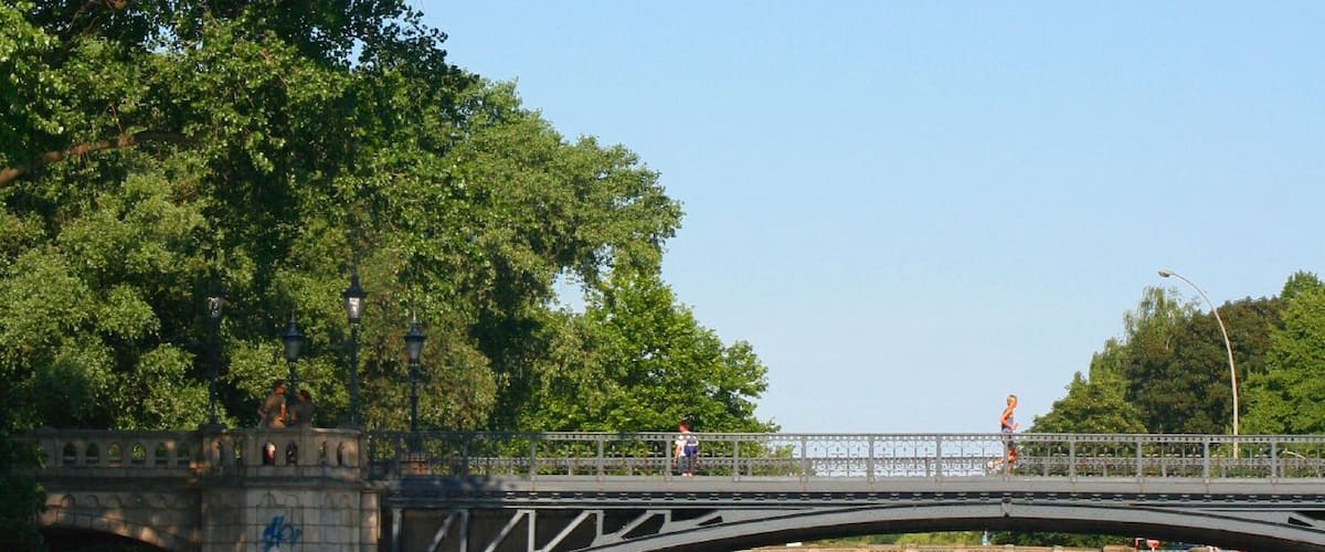 view from Außenalster into Mundsburg Canal, the lower reaches of the river Wandse, through Schwanenwik Bridge