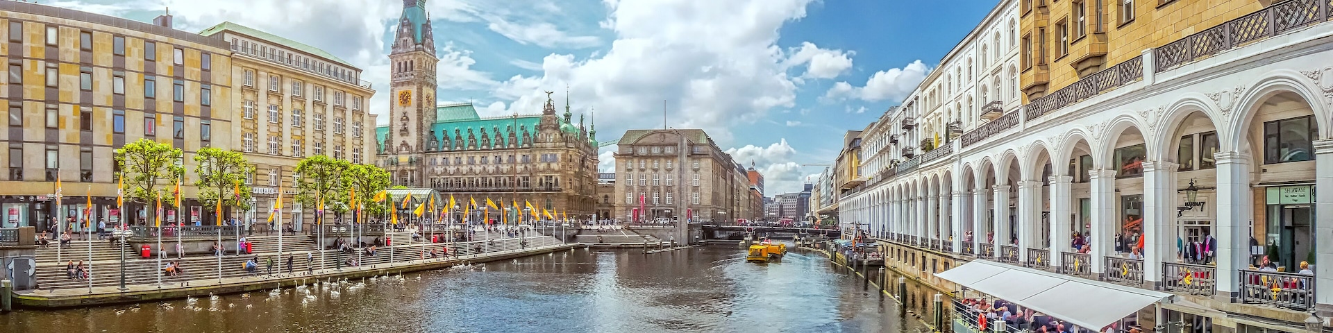 Beautiful panoramic view of historic Hamburg city center with famous town hall and Alster river on a sunny day with blue sky in summer, Germany; Shutterstock ID 455025175