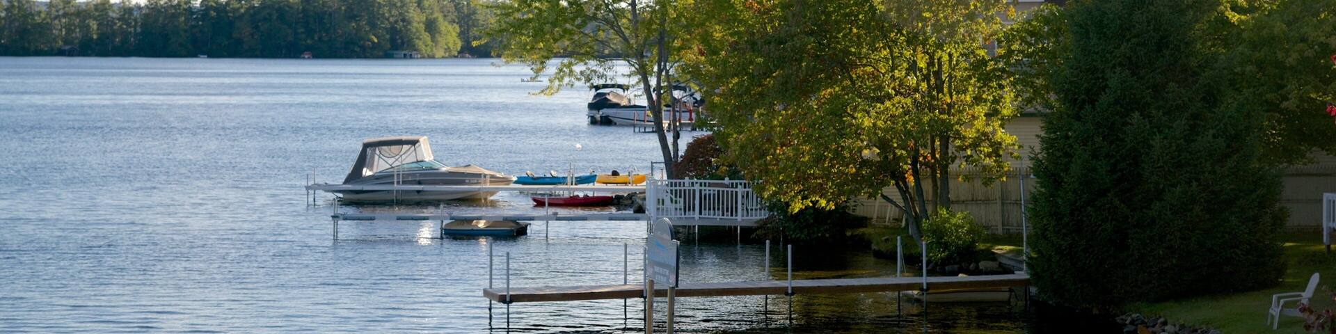 Laconia featuring a lake or waterhole and a bay or harbor