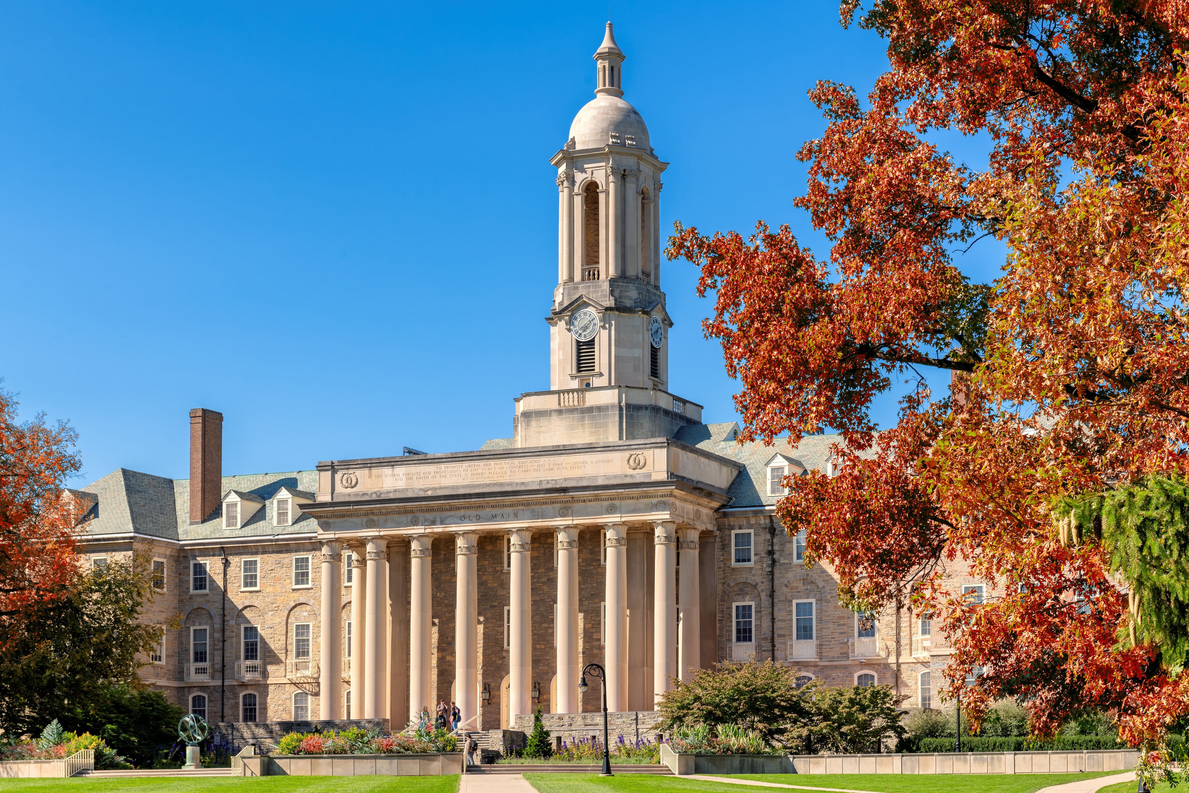 The Old Main building on the campus of Penn State University in autumn sunny day, State College, Pennsylvania.