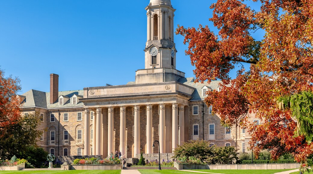 The Old Main building on the campus of Penn State University in autumn sunny day, State College, Pennsylvania.