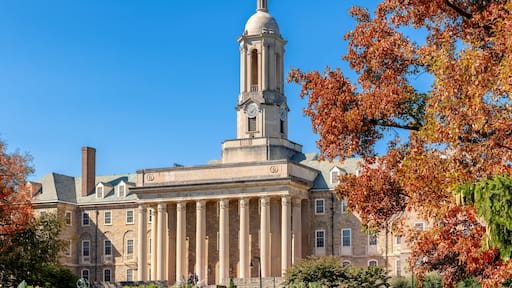 The Old Main building on the campus of Penn State University in autumn sunny day, State College, Pennsylvania.