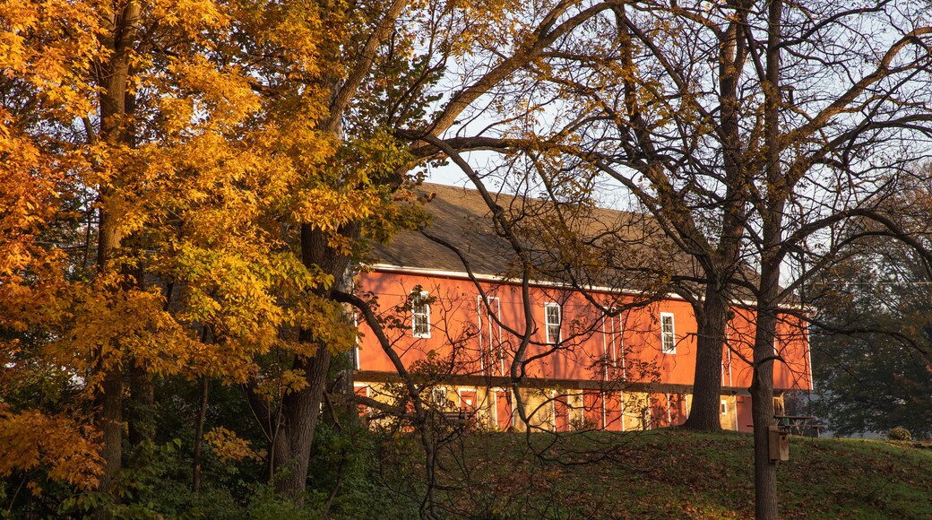 Dawn reflects on a red barn in a Pennsylvania park