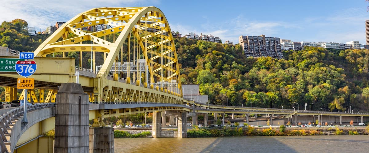 Downtown Pittsburgh which includes a bridge and a river or creek