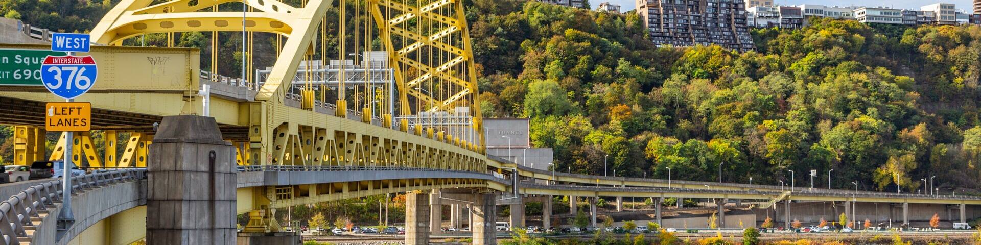 Downtown Pittsburgh which includes a bridge and a river or creek