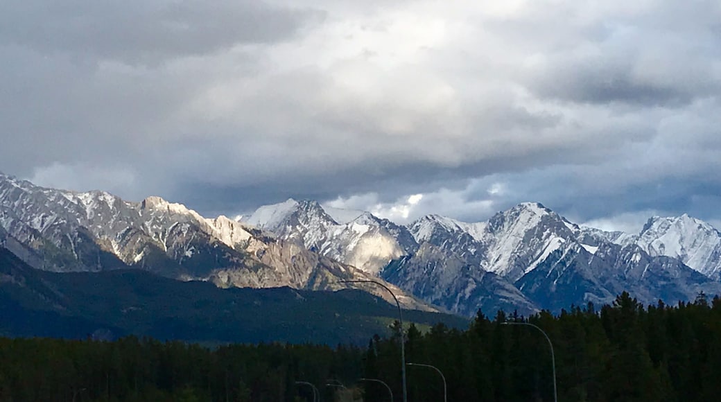 Heading eastbound on TransCanada 1 just before Banff, I was stuck by the beauty of the afternoon sun lighting up the mountains. I pulled off at the Hwy 93 exit and climbed up a rickety billboard scaffold (not recommended) to capture this shot.