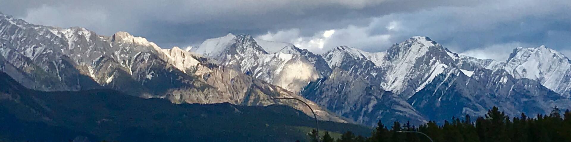 Heading eastbound on TransCanada 1 just before Banff, I was stuck by the beauty of the afternoon sun lighting up the mountains. I pulled off at the Hwy 93 exit and climbed up a rickety billboard scaffold (not recommended) to capture this shot.