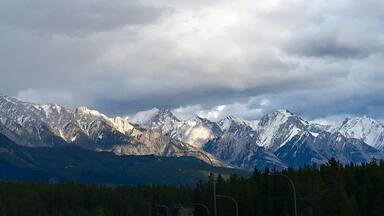 Heading eastbound on TransCanada 1 just before Banff, I was stuck by the beauty of the afternoon sun lighting up the mountains. I pulled off at the Hwy 93 exit and climbed up a rickety billboard scaffold (not recommended) to capture this shot.