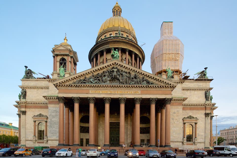 A grand neoclassical building with a large dome and statues.