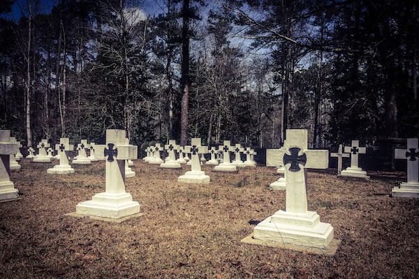 Final resting place for Brother Joseph, who created the art that is known as Ave Maria Grotto.This is a cemetery of only monks in residence at St. Bernard Abbey.
Ave Maria Grotto, in Cullman, Alabama, is a landscaped, 4-acre park in an old quarry on the grounds of St. Bernard Abbey, providing a garden setting for 125 miniature reproductions of some of the most famous religious structures of the world. It was added to the Alabama Register of Landmarks and Heritage on February 24, 1976, and to the National Register of Historic Places on January 19, 1984.
The stone and concrete models are the work of Brother Joseph Zoettl, a Benedictine monk of St. Bernard's Abbey, who devoted some 50 years to the project, the last three decades (1932 to 1961) almost without interruption. They incorporate discarded building supplies, bricks, marbles, tiles, pipes, sea shells, marbles, plastic animals, costume jewellery, toilet bowl floats and cold cream jars.
Born in 1878 in the Kingdom of Bavaria, Brother Joseph was maimed in an accident that left him slightly hunched due to cervical kyphosis. He immigrated to the United States as a teenager, settling in northern Alabama. Soon afterward he began studying at the newly founded Benedictine monastery of St. Bernard, where he took his vows in 1897. Br. Joseph was not allowed to be ordained as a priest, due to the rule of the period that stated any man with a distracting disability could not be ordained a priest. He ran the monastery’s power plant and was, even by a monk's standards, a withdrawn, quiet man. Brother Joseph rarely left Alabama, where he died in 1961.