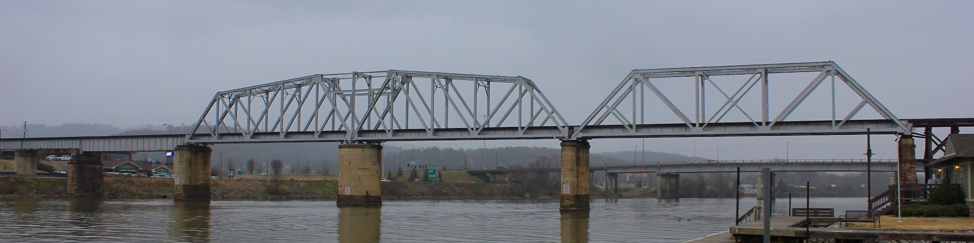 View of the CSX Railroad trestle over the Coosa River in Gadsden, Alabama. The bridge was built in 1888 in the swing bridge design to allow the center section to rotate and swing open which would allow steamboat traffic to pass on the river.