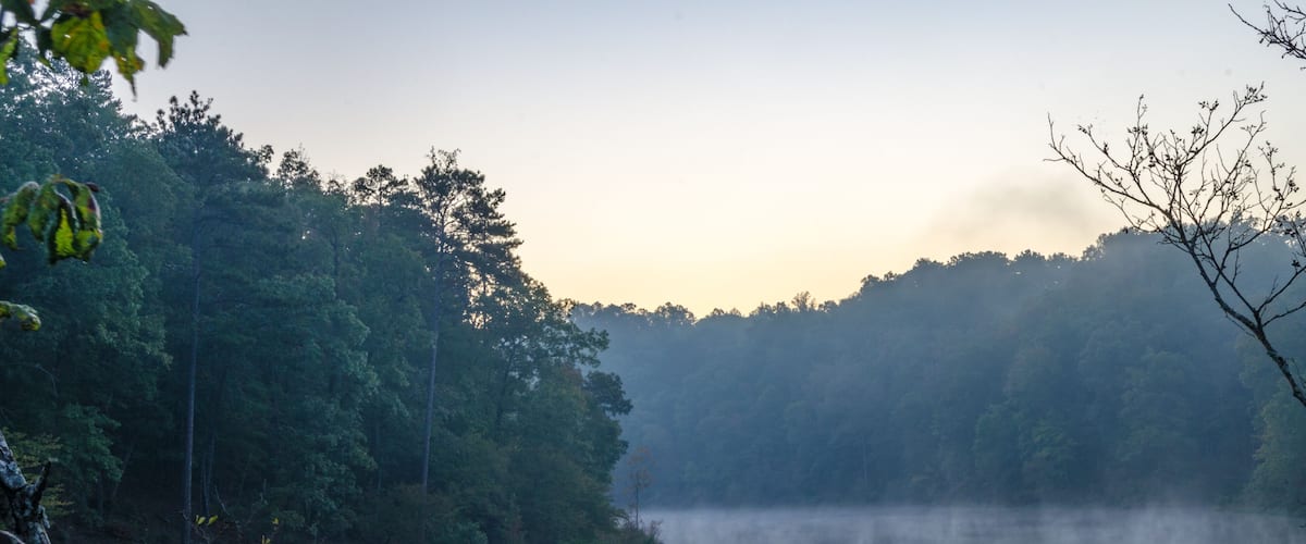 Fog forms over part of a water reservoir near Oxford, Alabama, USA