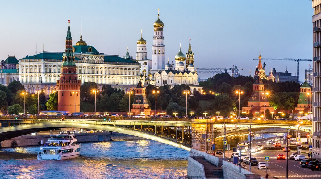 Moscow Kremlin at night, Russia. Panoramic view of city. Cityscape with Moskva River in evening.
