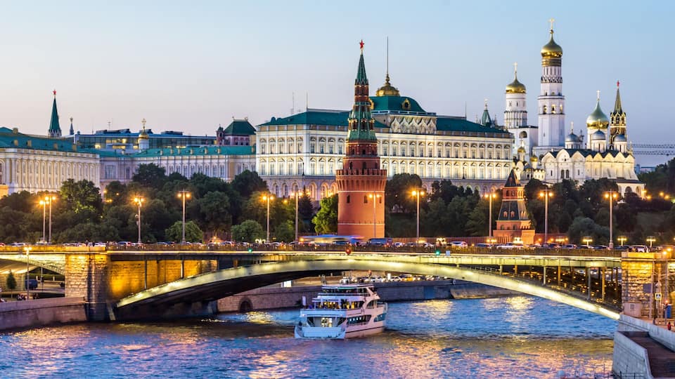 Moscow Kremlin at night, Russia. Panoramic view of city. Cityscape with Moskva River in evening.