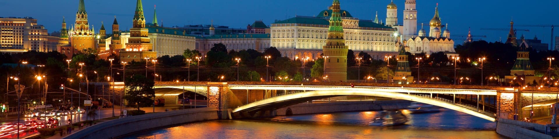 Moscow Kremlin featuring night scenes, a ferry and a river or creek