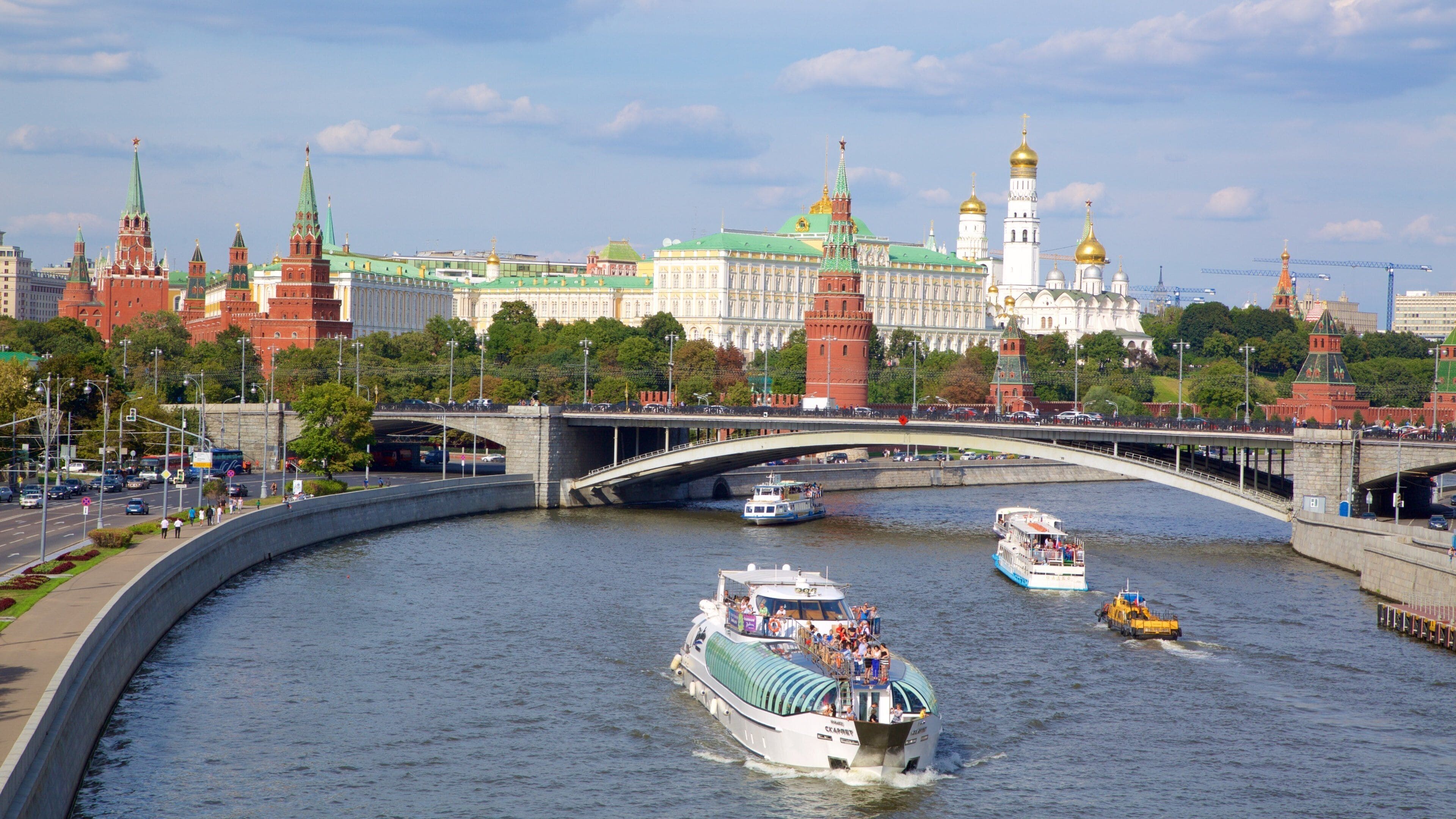 Moscow Kremlin featuring a city, a ferry and a bridge