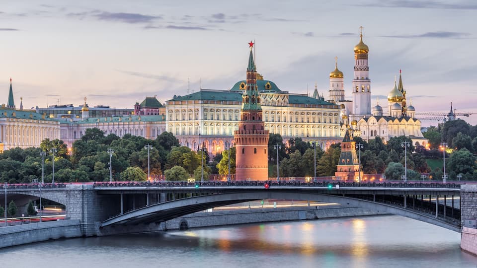 Moscow Kremlin at dusk, Russia. Panoramic view of the famous Moscow center in summer evening. Ancient Kremlin is a top landmark of Moscow. Beautiful cityscape of the old Moscow city in twilight.