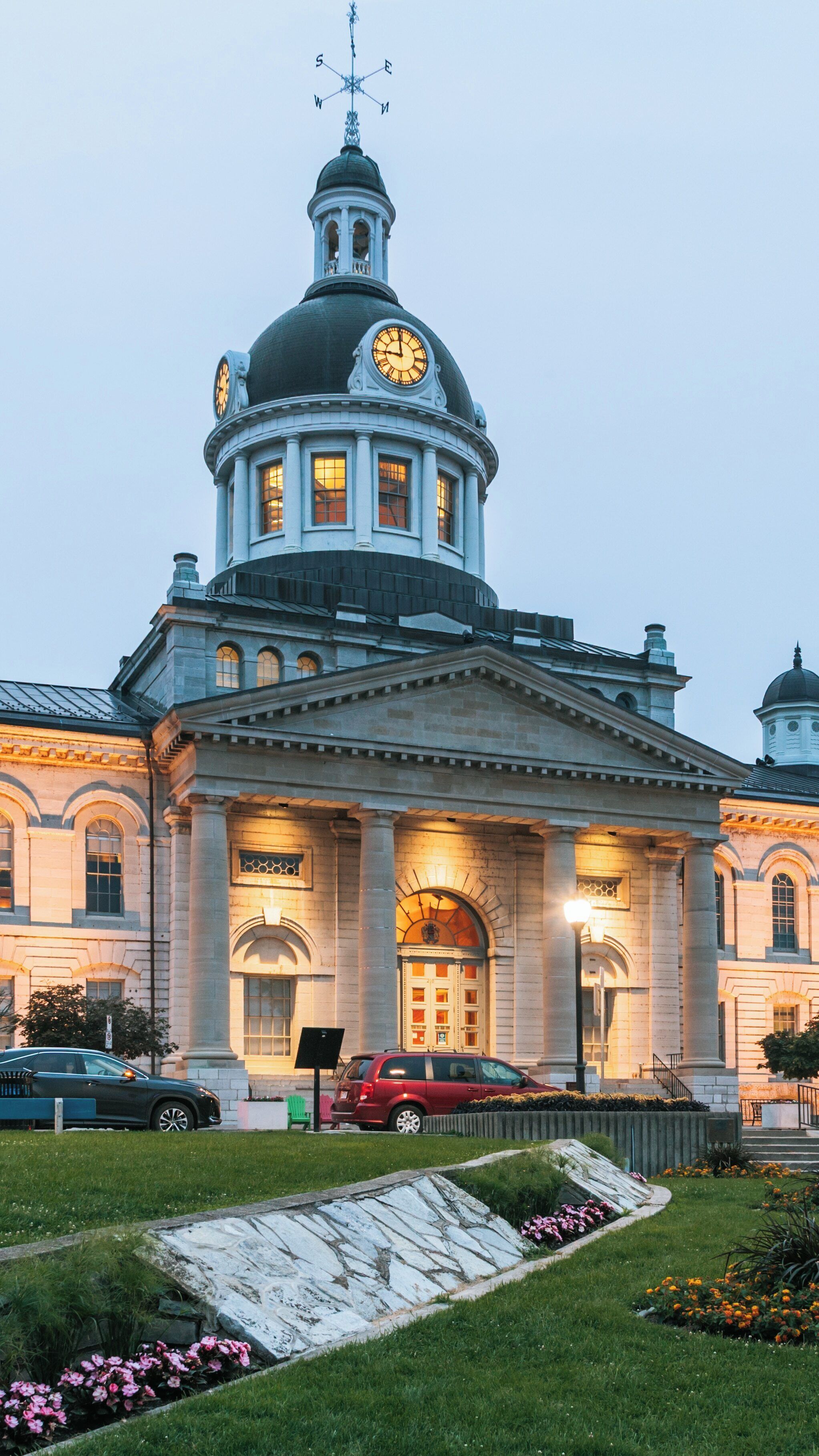 Kingston City Hall illuminated at twilight in Sydenham, Kingston, Ontario, showcasing stunning architecture and a serene atmosphere