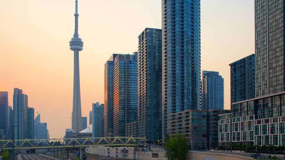A cityscape with modern high-rise buildings and a prominent tower.