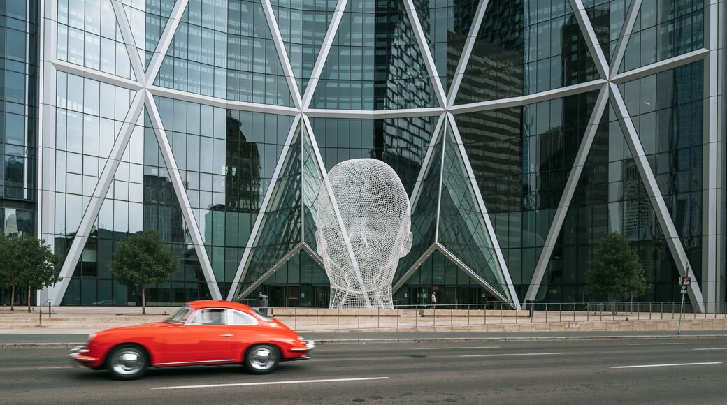 Wonderland Sculpture featuring outdoor art and a city