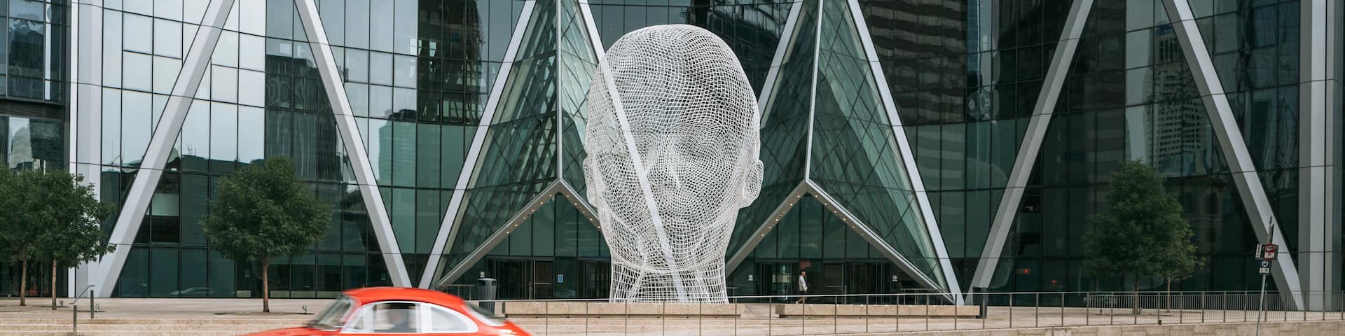 Wonderland Sculpture featuring outdoor art and a city
