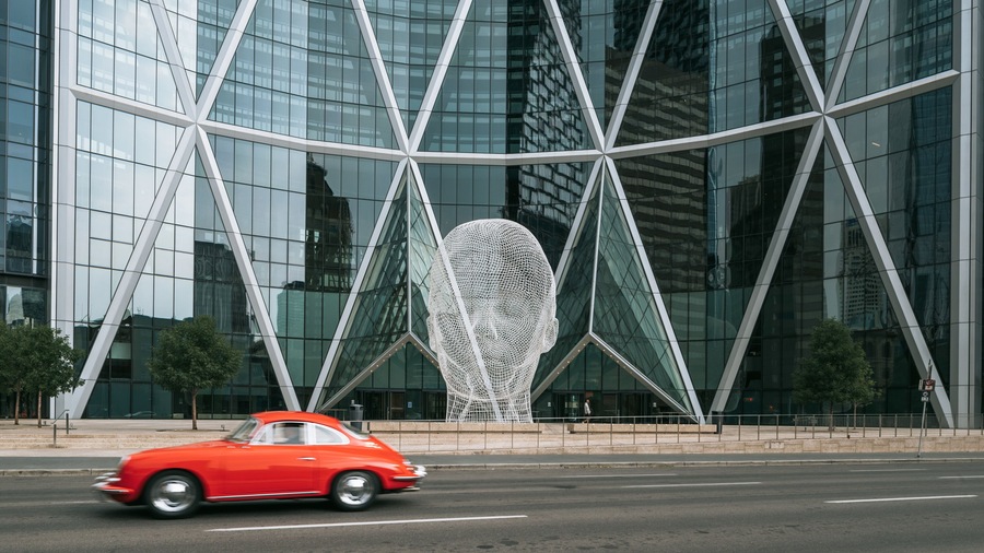 Wonderland Sculpture featuring outdoor art and a city