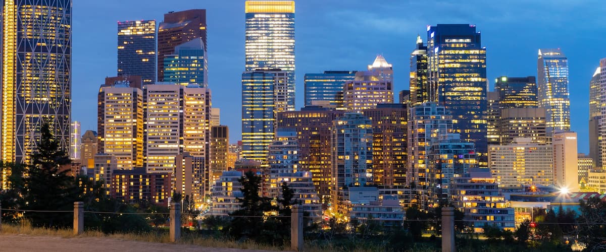 Downtown Calgary showing a city and night scenes